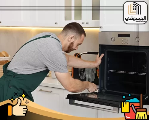 تصليح أدوات كهربائية أبوظبي 0545473541 الدسوقي صيانة فرن كهربائي داخل المطبخ بعد فتح باب الفرن للفحص.